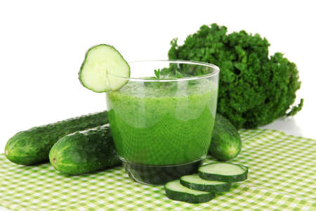 Green vegetable juice on table on white backgroundの写真素材