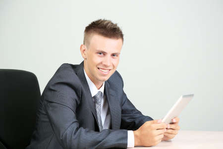 Portrait of young businessman working in officeの写真素材