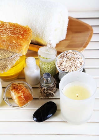 Honey and milk spa with oils and honey on wooden table close-upの写真素材