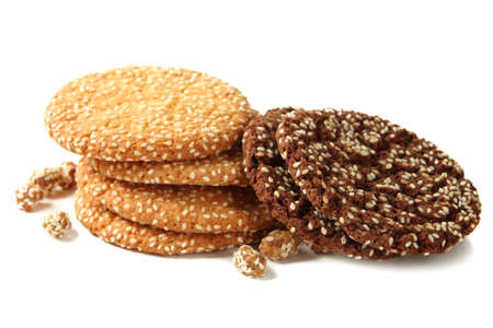 Homemade cookies with sesame seeds, isolated on whiteの写真素材