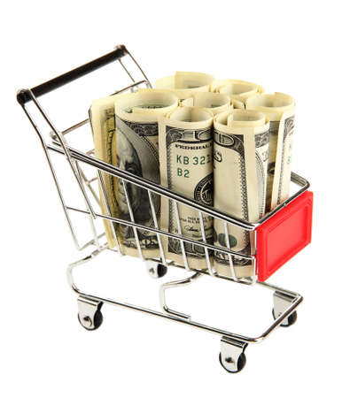 Shopping trolley with dollars, isolated on whiteの写真素材