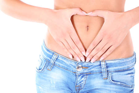 Heart on stomach isolated on whiteの写真素材