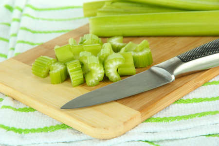 Fresh green celery on cutting board close-upの写真素材