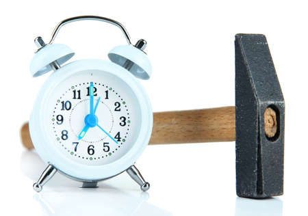 Hammer and alarm clock isolated on whiteの写真素材