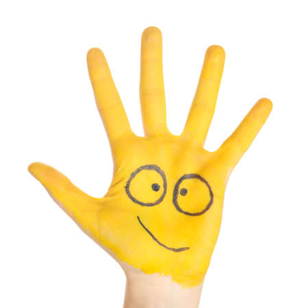 Painted hand with smile isolated on whiteの写真素材