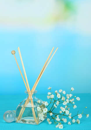 Aromatic sticks for home with floral odor on blue backgroundの写真素材