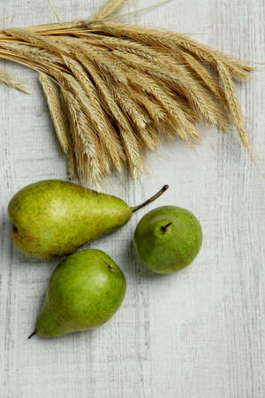 Pears and sheaf on wooden の写真素材