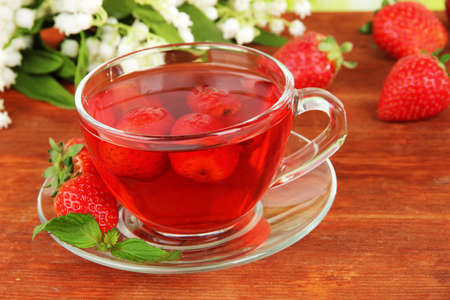Delicious strawberry tea on table close-upの写真素材