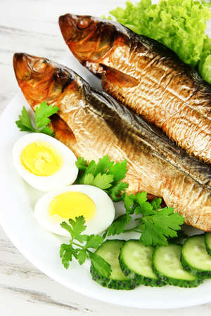 Smoked fish on plate close upの写真素材