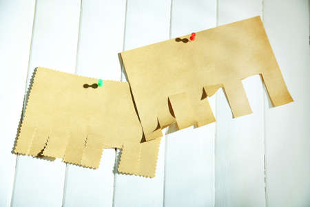 Paper ads on wooden backgroundの写真素材