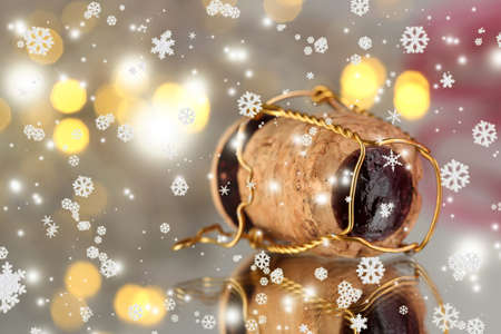 Champagne cork on Christmas lights backgroundの写真素材