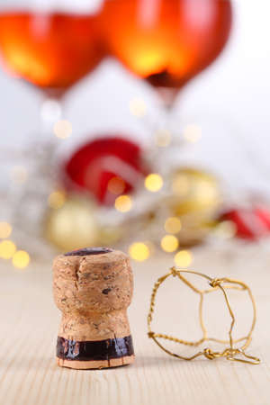 Champagne cork on Christmas lights backgroundの写真素材