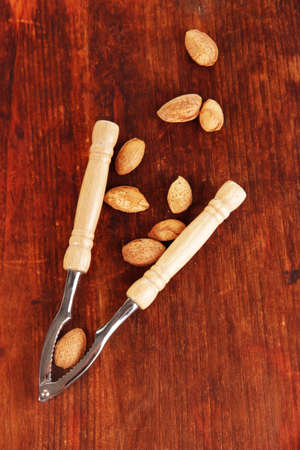 Nutcracker with nuts on wooden table close-upの写真素材