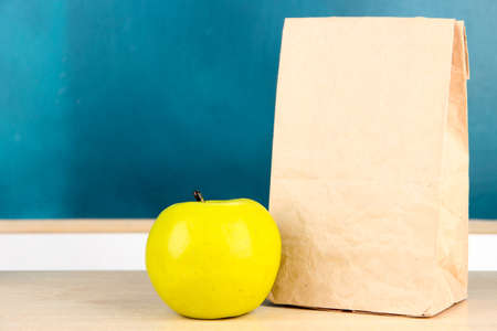School breakfast on desk on  board backgroundの写真素材