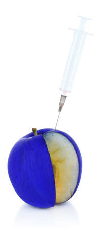 Injection into apple isolated on whiteの写真素材