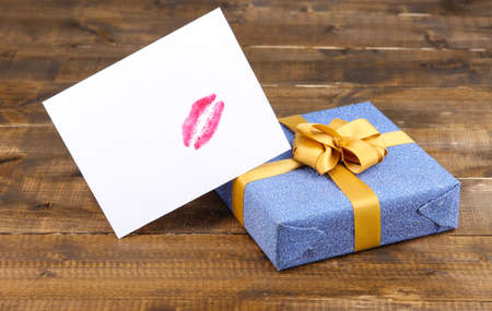 Gift with card for loved one on table close-upの写真素材