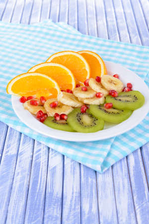 Sweet fresh fruits on plate on table close-upの写真素材