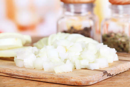 Cut onion on cutting board on wooden backgroundの写真素材