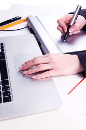 Female hand using graphics tablet on table close upの写真素材