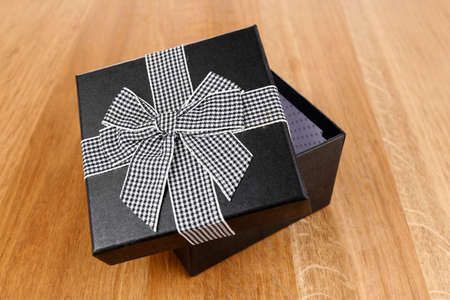 Open gift box on wooden backgroundの写真素材