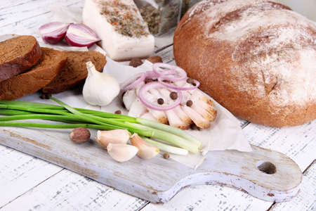 Rye bread with lard and onion on table close upの写真素材