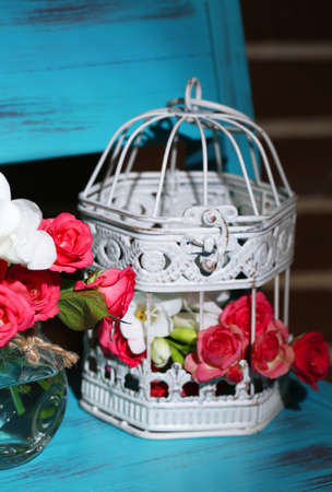 Beautiful still life with small pink roses and freesia flowersの写真素材