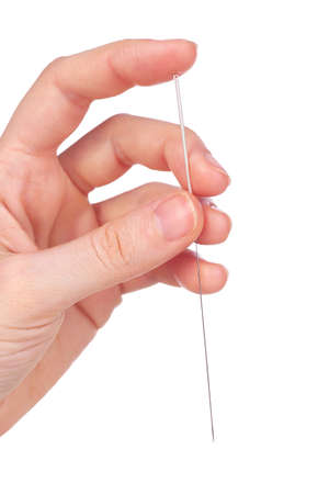 Hand holding needle for acupuncture on hand, close up. Isolated on whiteの写真素材