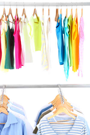 Different clothes on hangers, on gray backgroundの写真素材
