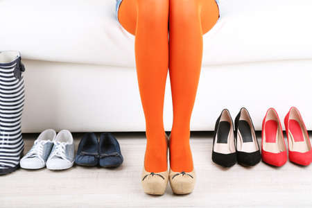 Perfect woman legs and different shoes, close upの写真素材