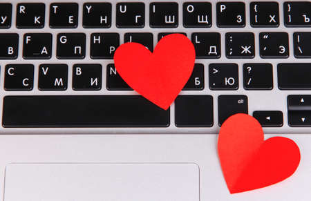 Red hearts on computer keyboard close upの写真素材