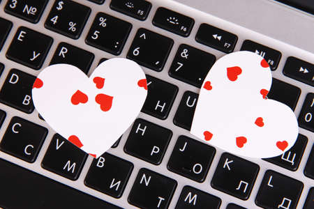 Bright hearts on computer keyboard close upの写真素材