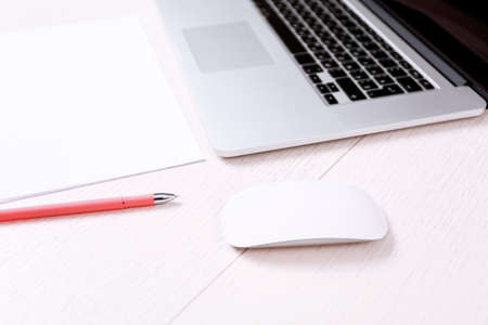 Office workplace with laptop on wooden deskの写真素材