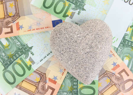 Love for money concept. Heart on European currencyの写真素材