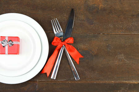 Romantic holiday table setting, on wooden backgroundの写真素材