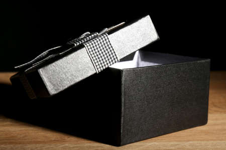 Open gift box on dark backgroundの写真素材