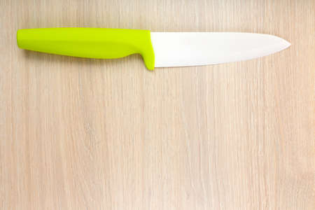 Kitchen knife on wooden tableの写真素材