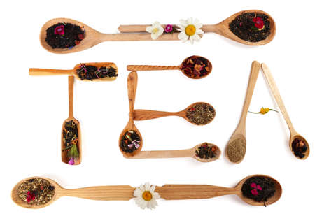 Assortment of dry tea in wooden spoons,  isolated on whiteの写真素材