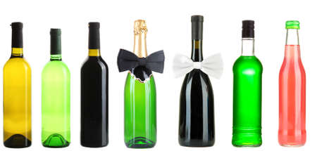 Collage of different alcohol bottles isolated on whiteの写真素材