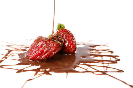Red ripe strawberries with chocolate, isolated on whiteの写真素材