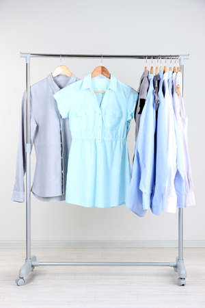 Office clothes on hangers, on gray backgroundの写真素材