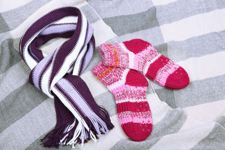 Winter scarf and socks,  on color backgroundの写真素材