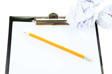 Crumpled paper balls with pencil and clipboard isolated on whiteの写真素材