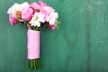 Beautiful wedding bouquet on wooden backgroundの写真素材