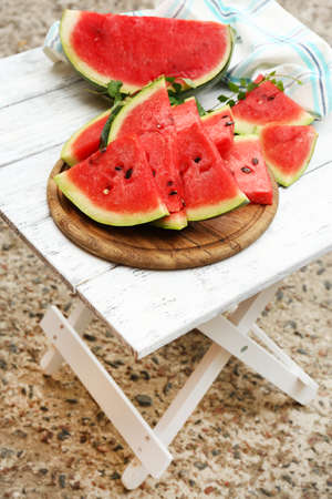 Fresh slices of watermelon on table, outdoorsの写真素材