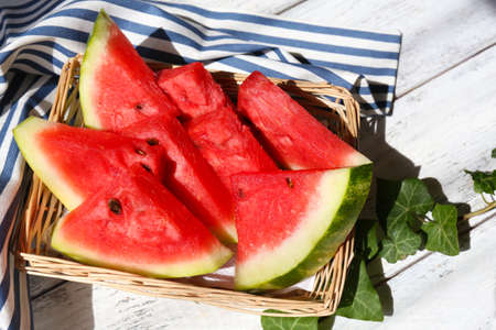 Fresh slices of watermelon on table, outdoorsの写真素材
