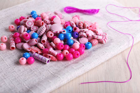 Different beads and lace on fabric on fabric backgroundの写真素材