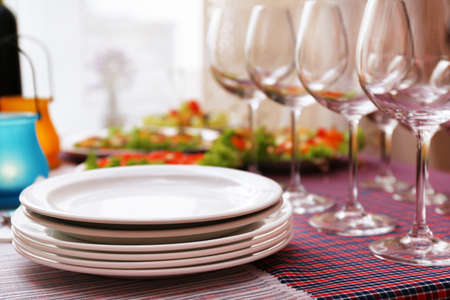 Buffet table with dishware waiting for guestsの写真素材