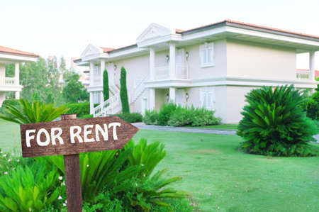 Real estate sign in front of new house for rentの写真素材
