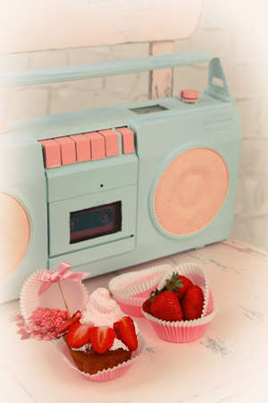 Tasty cup cake with retro radioの写真素材