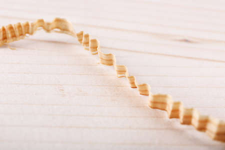 Wood shavings on wooden background closeupの写真素材